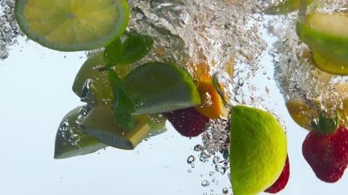 Fresh Fruit Slices Falling into Water