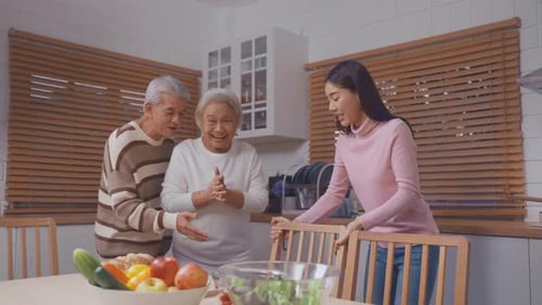 Young Woman Serves Meal to Senior Parents at Table