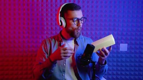 Man Unboxes and Reviews New Mobile Phone in Studio