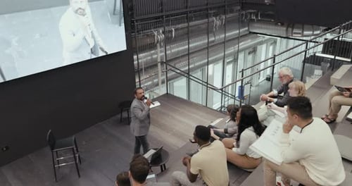 Corporate Presentation in Modern Office Auditorium Setting