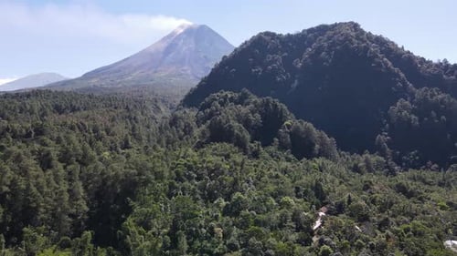 Aerial view, Mount Merapi in the morning when it emits eruption smoke and the weather is very sunny