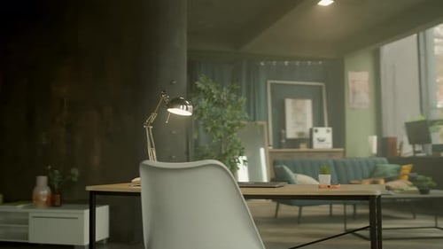 In Modern Office View on Desk with a Laptop and Notebook in Empty Space Workspace Camera Moving