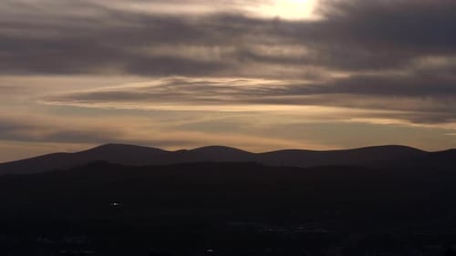 Dramatic Sky Over Mountain Ridge Silhouette Through Nightfall In South Ireland Near Dublin. - Static