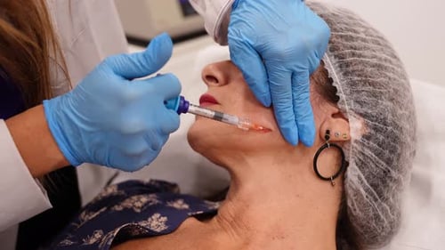 Mature Woman Receiving Biostimulator Facial Injection Treatment