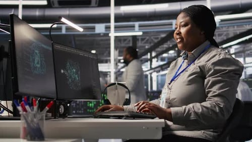 Data Center Computer Scientist Using PC to Monitor Artificial Intelligence