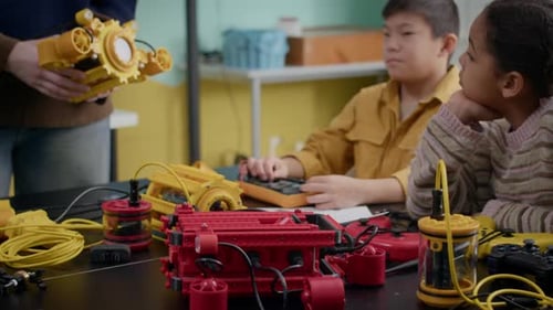 Children Building Robots in Classroom