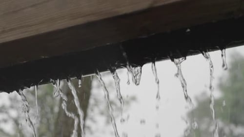 Rain Falling from a Ledge Outdoors in Daytime