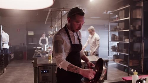 Chef Prepares Food in a Restaurant Kitchen