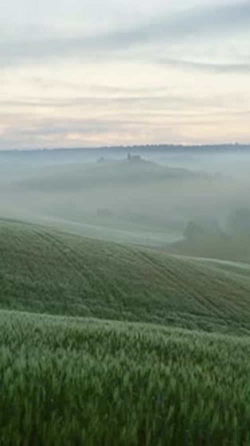 Tuscany landscape sunrise farm house and hills