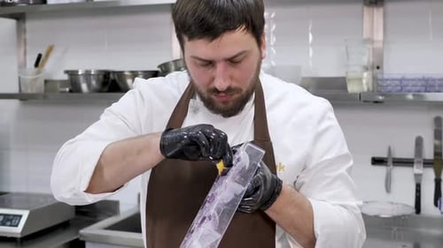 Chef Prepares Food in a Plastic Mold