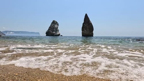 Small Sea Wave Blurred Soft Foamy Waves Washing Golden Sandy Beach and Volcanic Rocky Shores Nobody