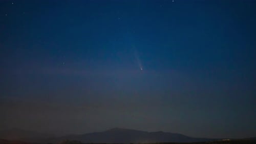 Radiant Comet Illuminates the Starry Night Sky