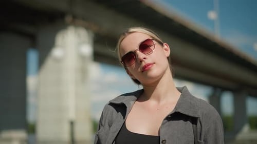 Stylish Woman Poses Outdoors on Sunny Day