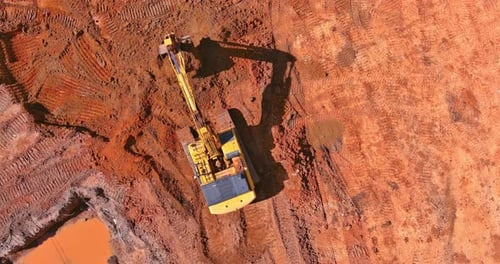 Preparing Area for Built Home Excavator Loads Earth Into Dump Truck on Construction