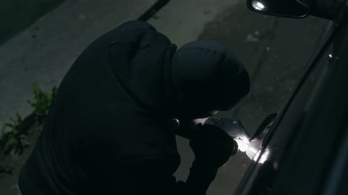 Car Thief Working at Night