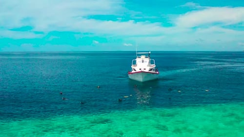 Local Fishermans Boat Set Up Fishing Nets in the Sea to Catch Fish on Local Island Ukulhas in