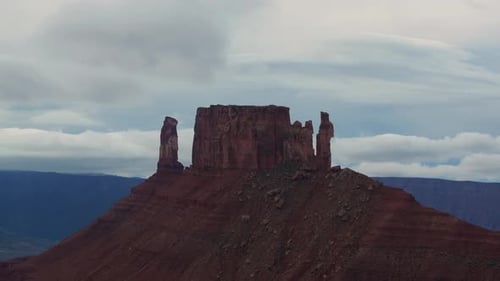 Dramatic sandstone mesa and cloudy skies captured in Moab from a breathtaking vantage