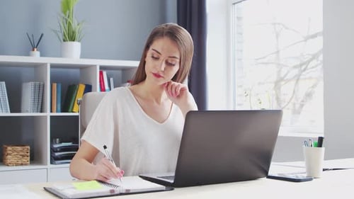 Young Woman Works at Home Office Using Computer Workplace of Female Entrepreneur Freelancer or