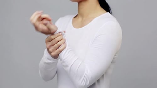 Woman Wrist Pain and Hand Exercise for Relief