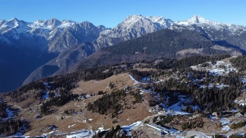 AERIAL Orbiting Shot of Snowy Mountain Plateau in Slovenian Alps