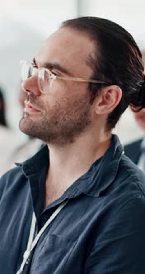 Man, thinking and listening in audience at conference for entrepreneurship