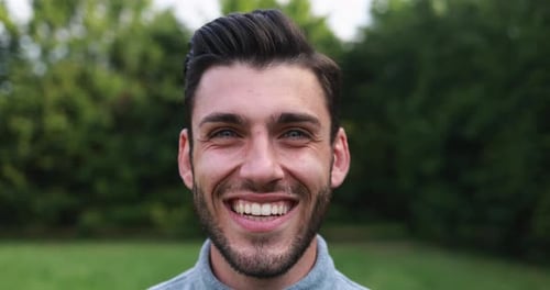 Smiling Man Close-Up in Natural Outdoor Setting