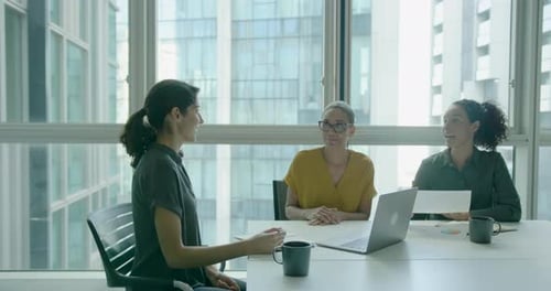 Three Businesswomen, Meeting and Working in Office