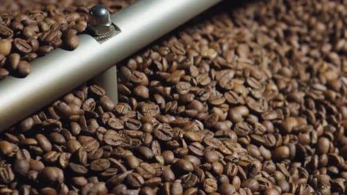 Coffee Beans Being Stirred in Roaster Close Up