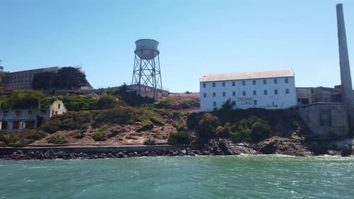 Gimbal close-up panning shot around Alcatraz Island from a moving boat in the San Francisco Bay. 4K