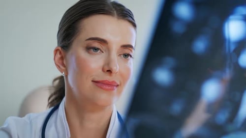 Female doctor analyzing x-ray in a hospital