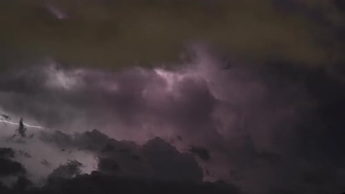 Cloudscape Filled With Lightning Bolts And Deep Colors During A Fierce Storm