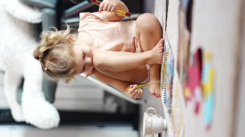 Child Painting Art on the Floor at Home