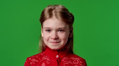 Smiling Little Girl Portrait on Green Background