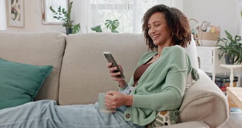 Woman Relaxing on Couch with Cell Phone