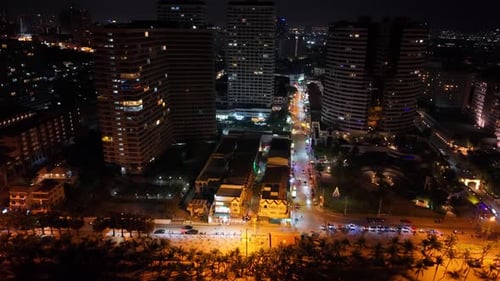 Nighttime Cityscape Aerial View of a Coastal City