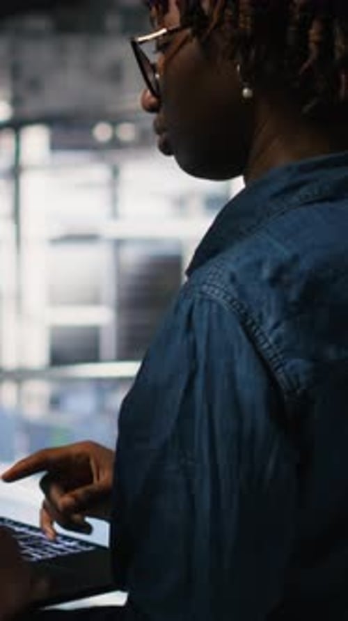 Vertical Video Server Farm Manager Overseeing Work Done By Engineer Reviewing LLM Visualization