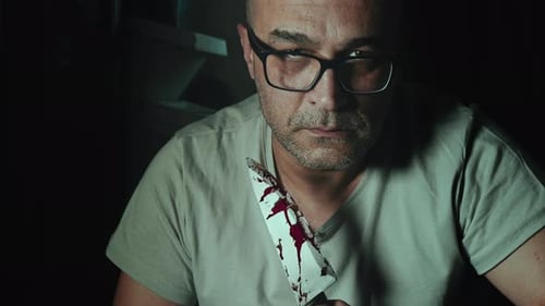 Frightening Man Holding Bloody Knife