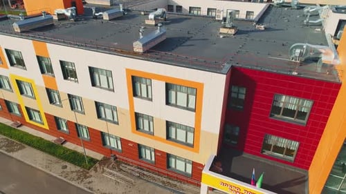 School Building with Orange Squares on Facade in City