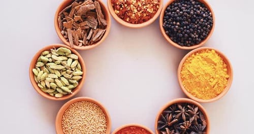 Spices, curry powder and bowls for seasoning, seeds and studio for herbs, top view and condiments