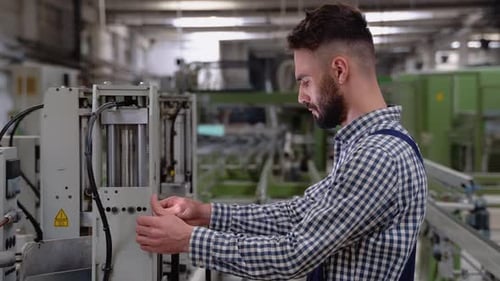 Smart Factory Worker Using Machine in Factory Workshop
