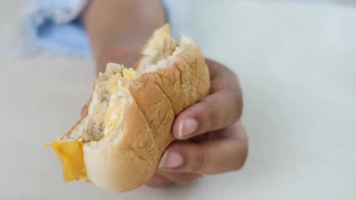 Women Hand Holding Beef Burger Top View