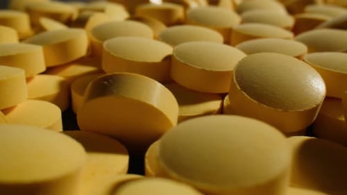 Pills and Vitamins Macro Close Up View of Womans Hands Holding Plenty of Different Drugs Painkillers