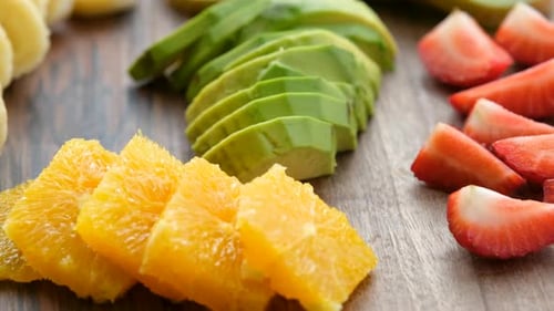Close Up View Of Fruits On A Wooden Plate Rotating Clockwise