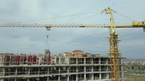 Tower Cranes and Frame Structure of High Residential Apartment Buildings at Construction Site