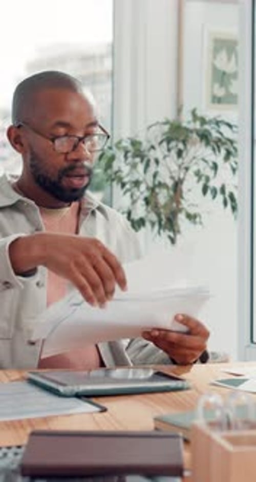 Analytics, documents and meeting with designer man in boardroom for social media marketing