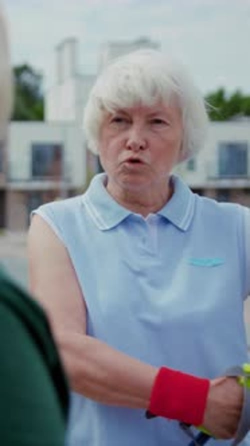 Senior Women Exercising on City Sidewalk