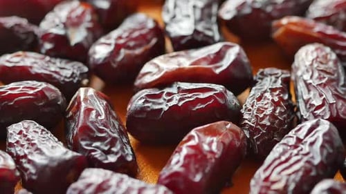 Slow Motion of Fresh Date Fruit Dropping on a Table