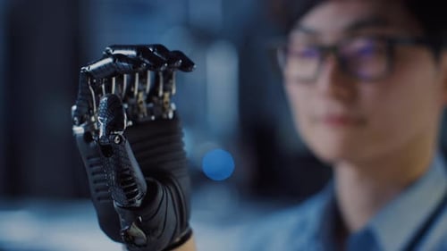 Close Up of a Futuristic Prosthetic Robot Arm Being Tested by a Professional Development Engineer i