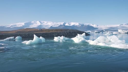 Icebergs in fast sea lagoon water currents on the coast of Iceland.