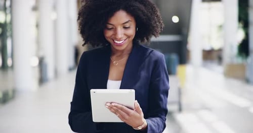 4k video footage of businesswoman using a digital tablet in an office